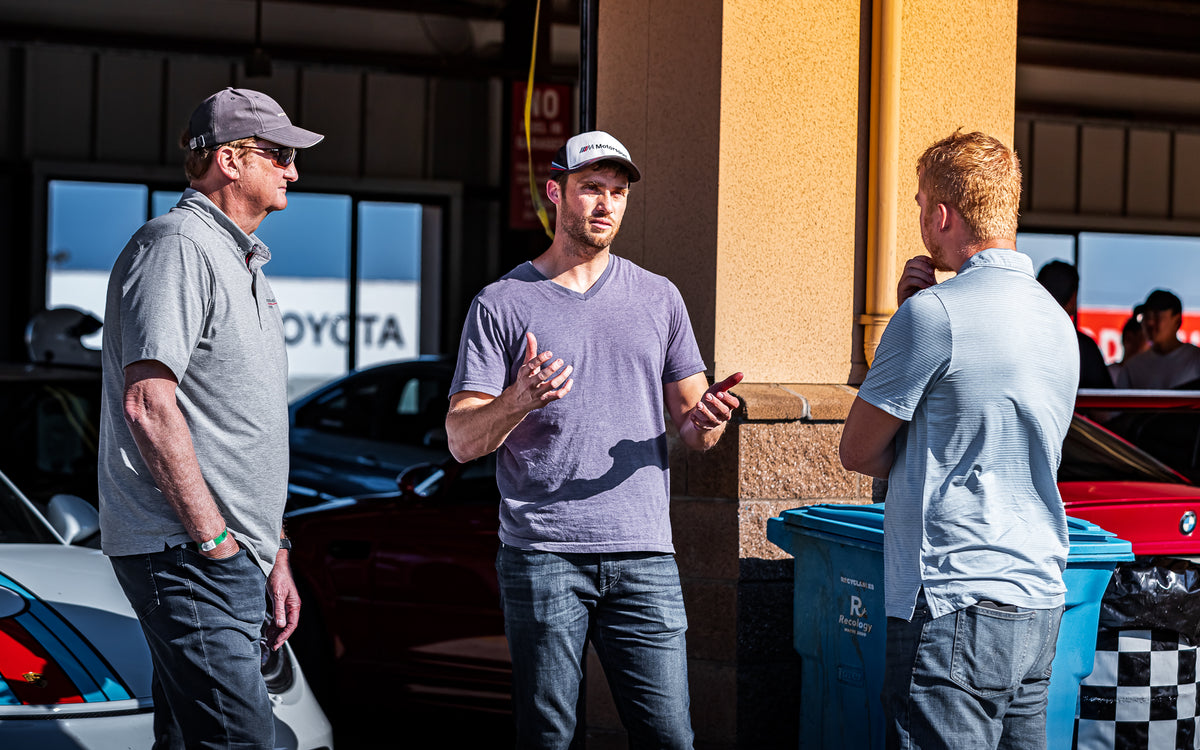 LightSpeed coaches talking with drivers in the Sonoma Raceway paddock